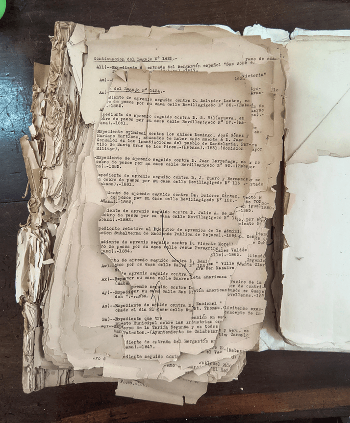 Picture shows one of the volumes with the titles of documents in the miscellaneous collection. Pages are torn and partially missing.